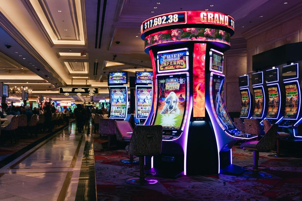 Rows of illuminated slot machines in a casino