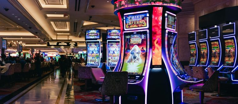 Rows of illuminated slot machines in a casino